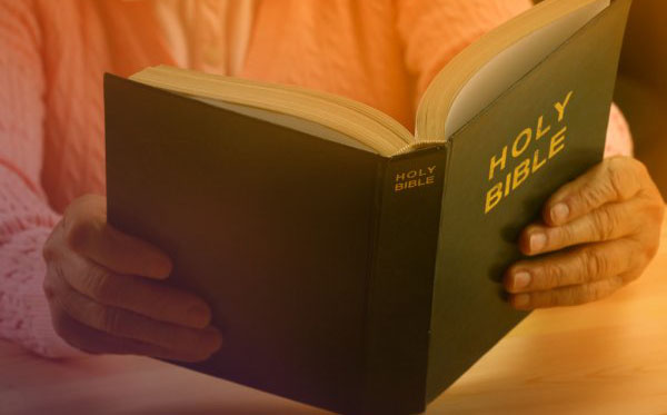depositphotos_61227885-stock-photo-old-woman-reading-bible-closeup